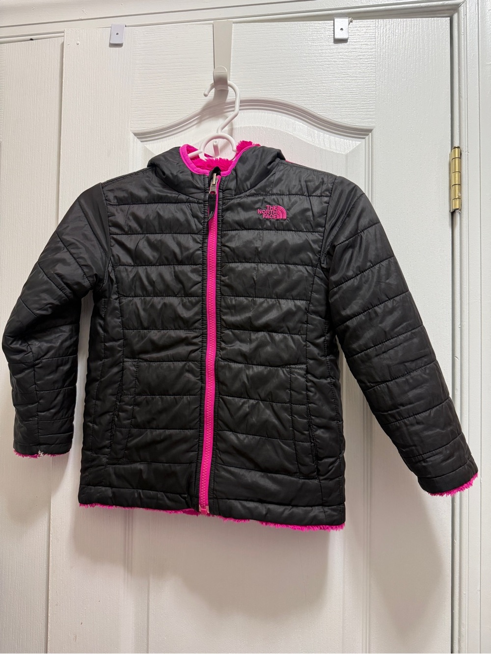 The North Face double sided Black nd hot pink Jacket with side pockets. Soft